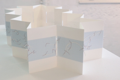 Untitled (concertina map book), installation view, cotton-rag paper, cotton thread, drafting film, graph paper, dimensions variable open, 18cm x 12cm closed, 2012